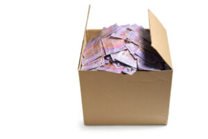 Save money when moving house box of 5 dollar Australian notes inside of moving box. 